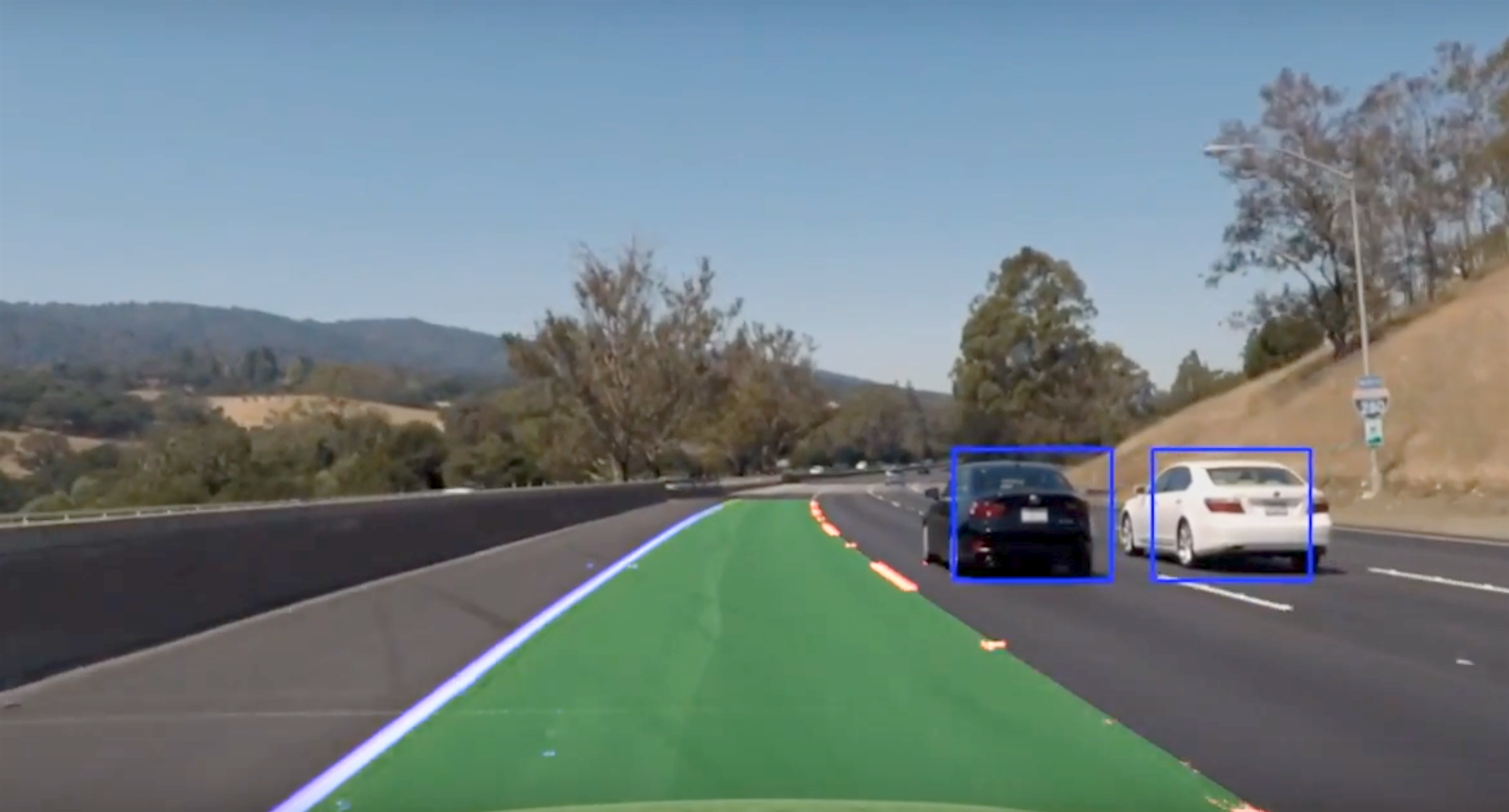 Color coded image of how a self-driving car "sees" lanes and surrounding vehicles.